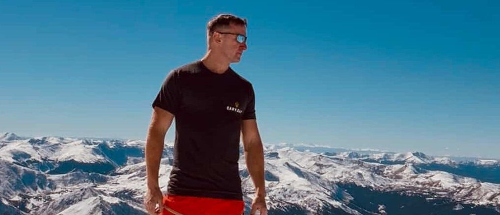Athlete wearing EASY DAY® Graphic Tee – mountain summit.