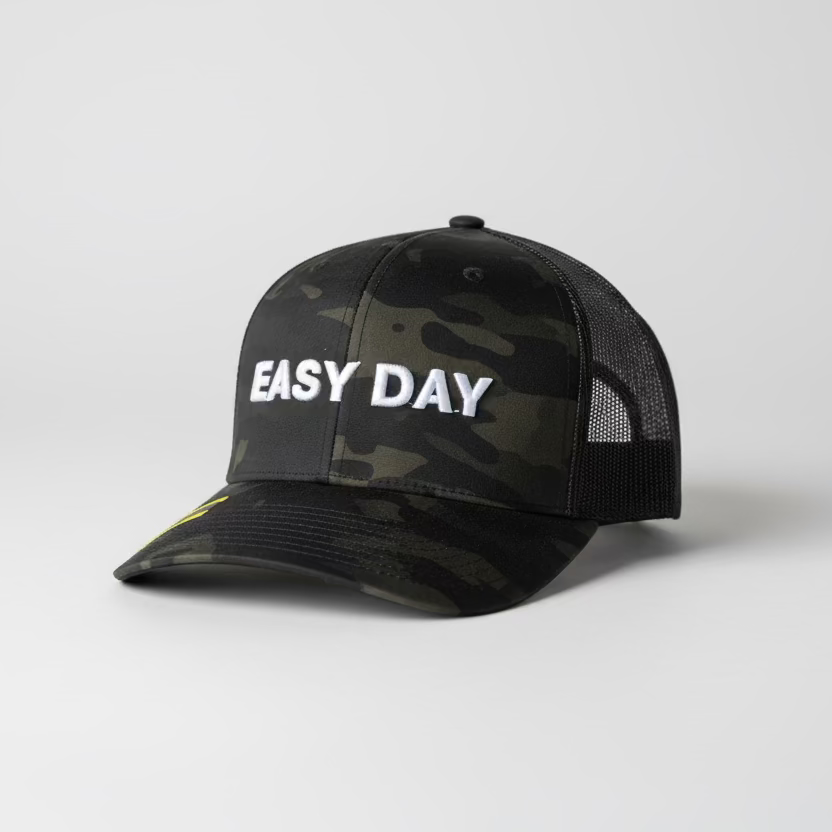 Black camouflage cap with 'EASY DAY' text on a white background