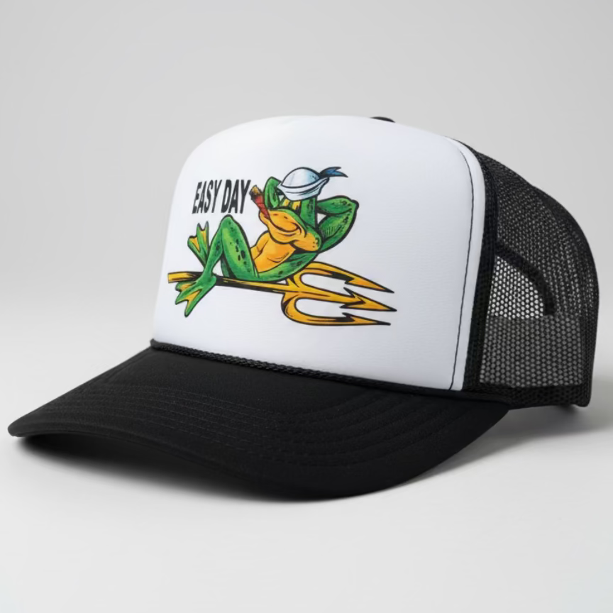 Trucker hat with a frog graphic and 'Easy Day' text on a wooden surface.