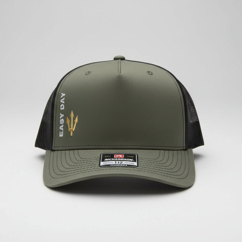 Three caps on a table outdoors with a blurred background