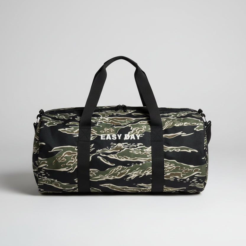 Camouflage backpack with 'EASY Day' branding on a wooden floor.