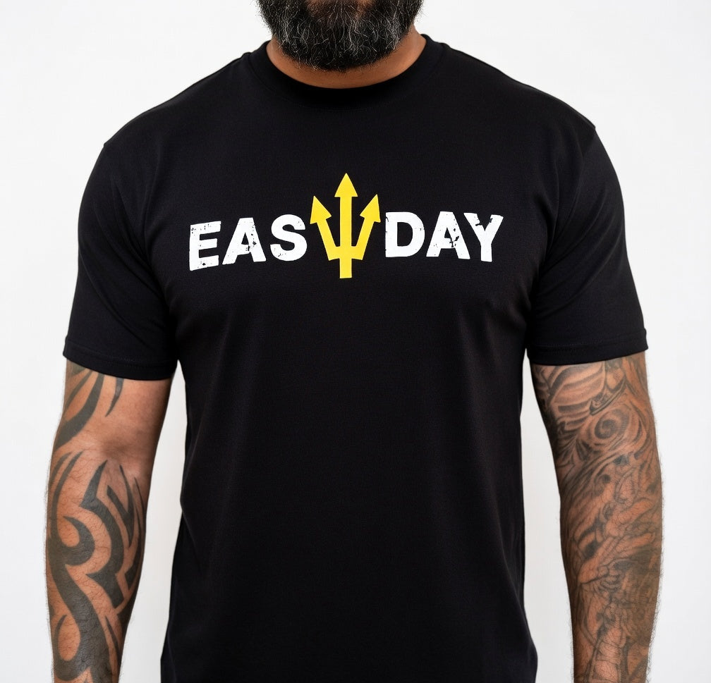 Black t-shirt with 'EAS DAY' printed on it worn by a person with tattoos.