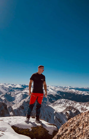 Athlete wearing EASY DAY® Graphic Tee – mountain summit.