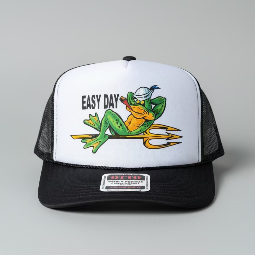 Trucker hat with a frog graphic and 'Easy Day' text on a concrete surface.