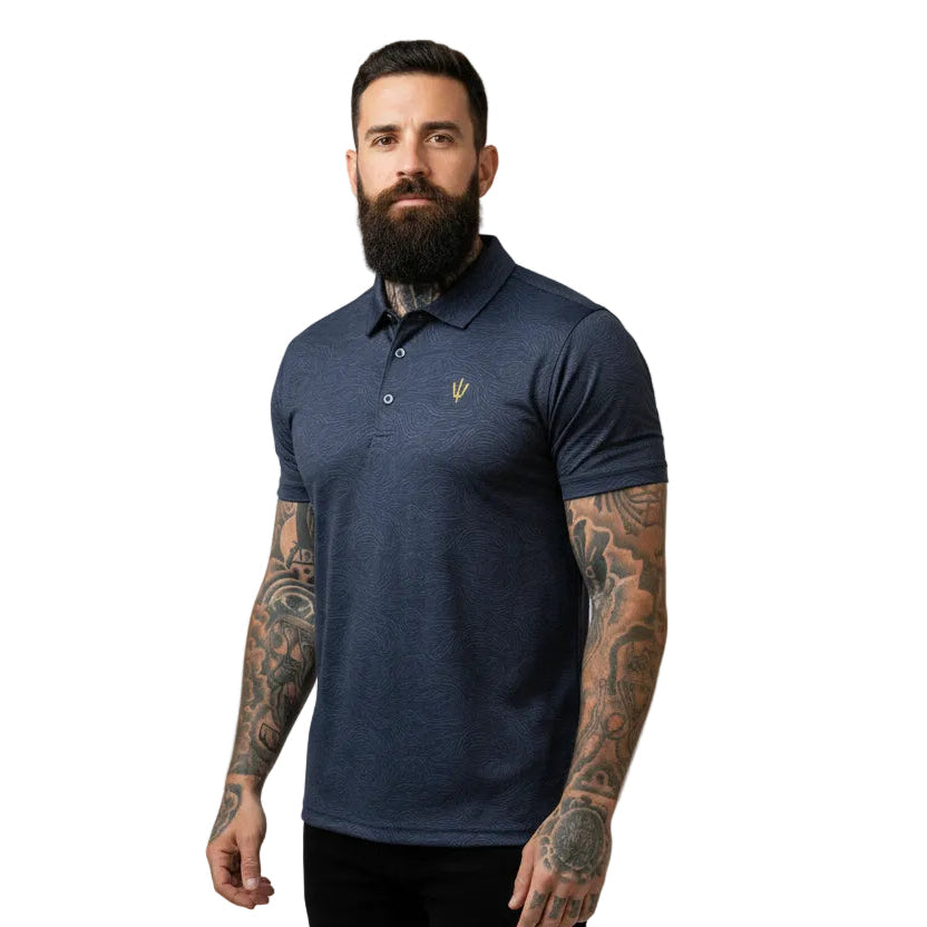 Man wearing a navy blue polo shirt with a small logo on a white background