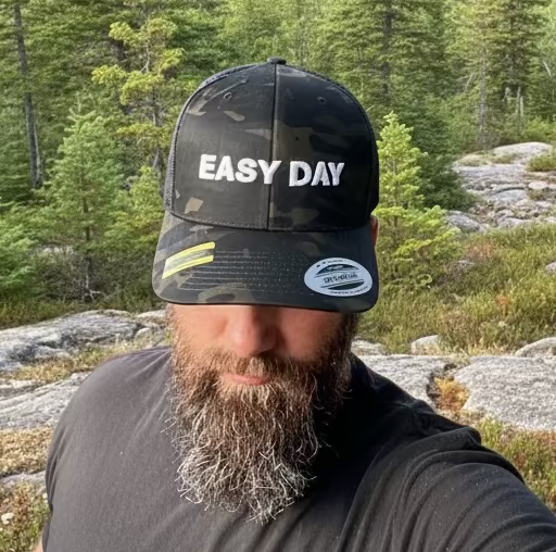 Person wearing a cap with 'EASY DAY' text in an indoor setting