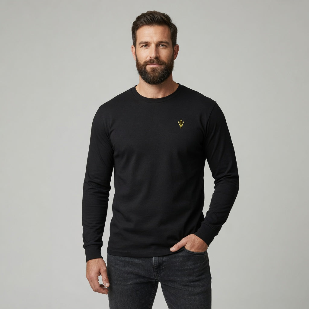 Man wearing a black long-sleeve shirt with a yellow logo on a gray background